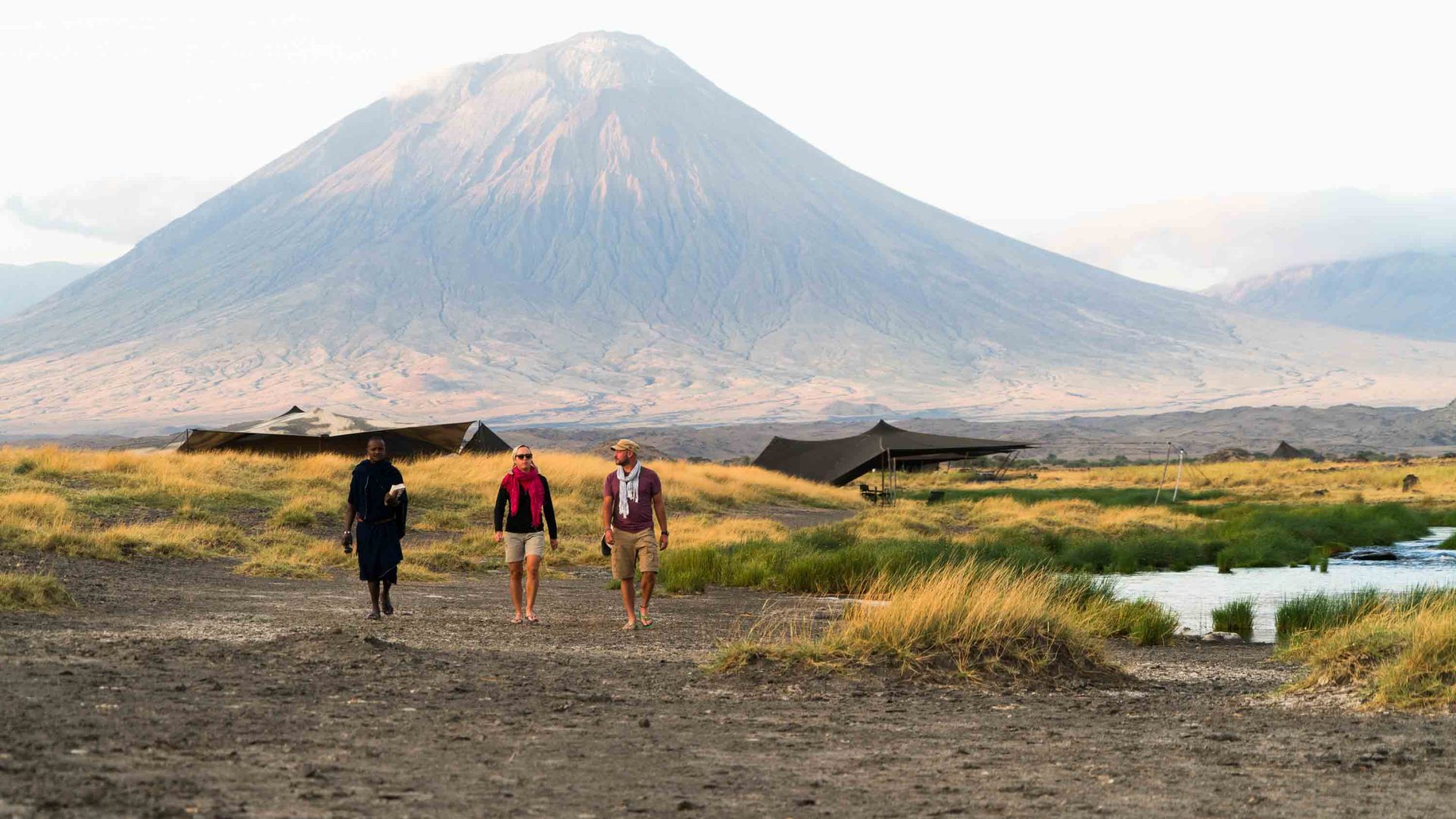 The writer, guide and friend walk away from camp and OI Doinyo Lengai.