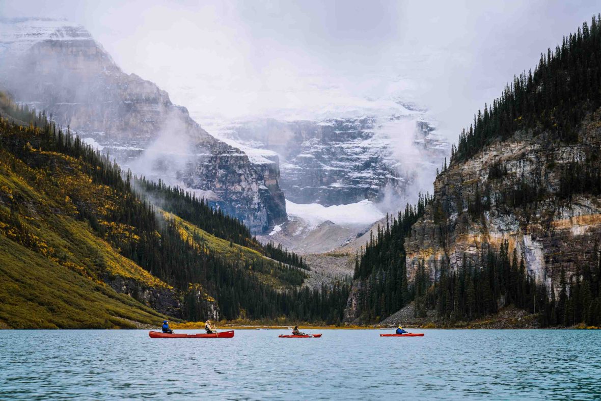 Several kayakers on a lake.