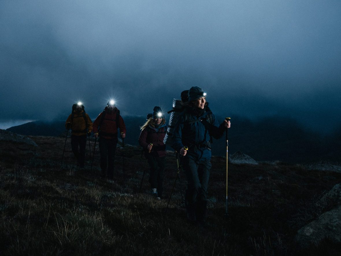 hikers wearing head lamps