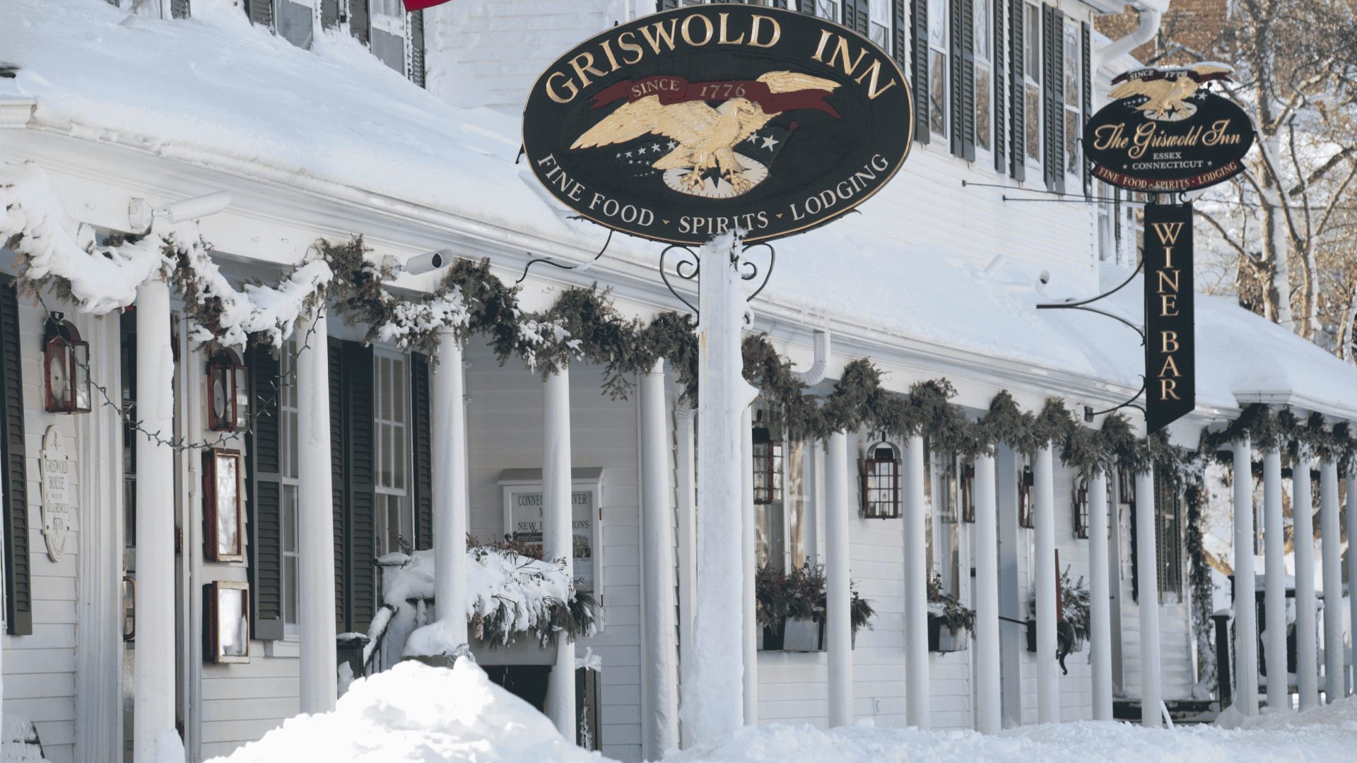 A snowy image of the exterior of the Griswold Inn in Connecticut.