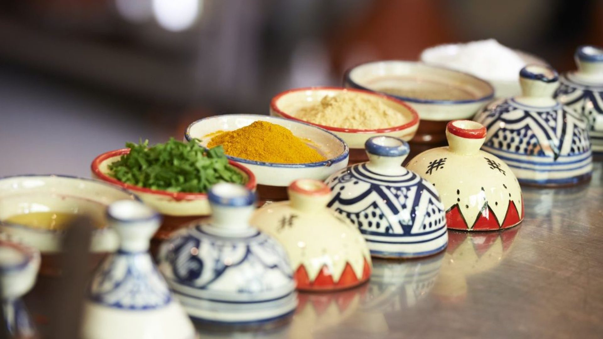 A range of spices in colorful jars