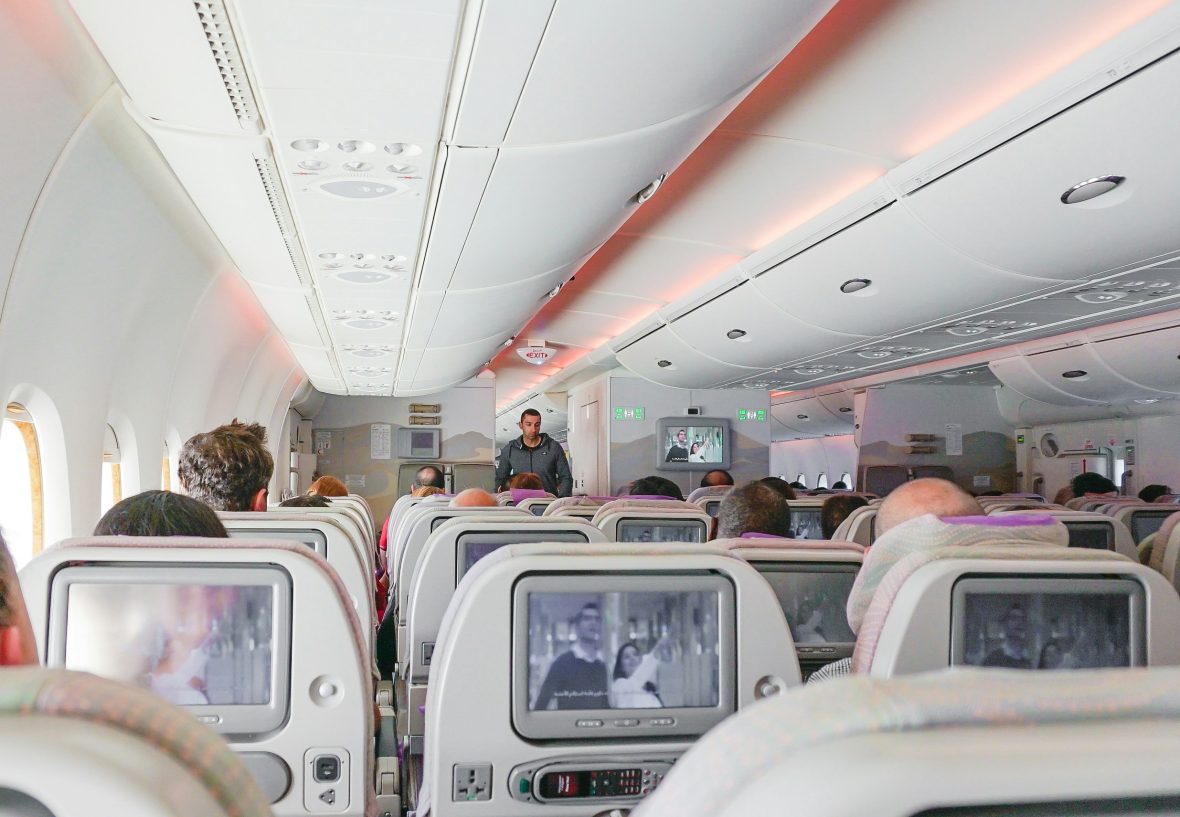 Rows of seatback TVs during a flight