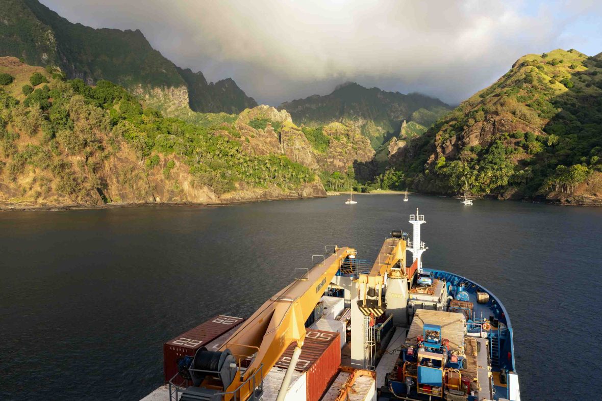 The front of the Aranui, laden with cargo, heads toward the vegetation on one of the islands of Marquesas Islands.