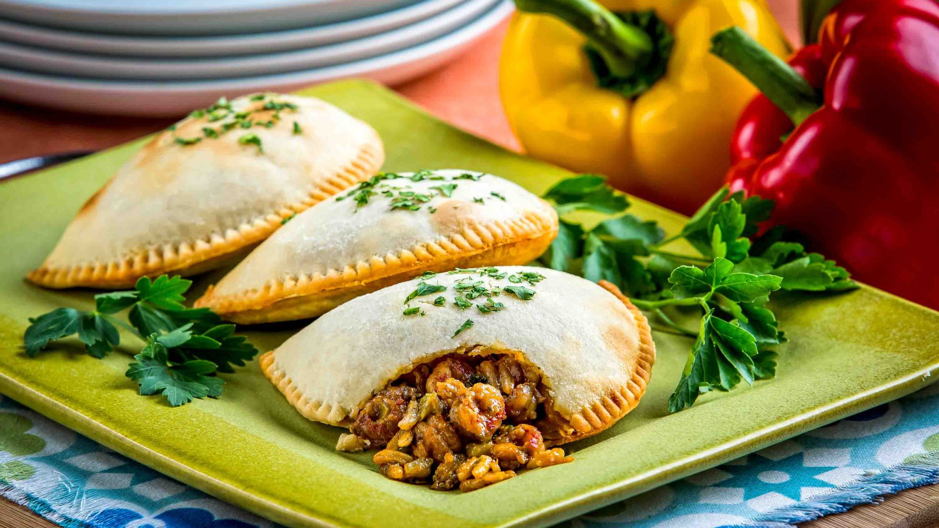 Pies spilling open on a plate.