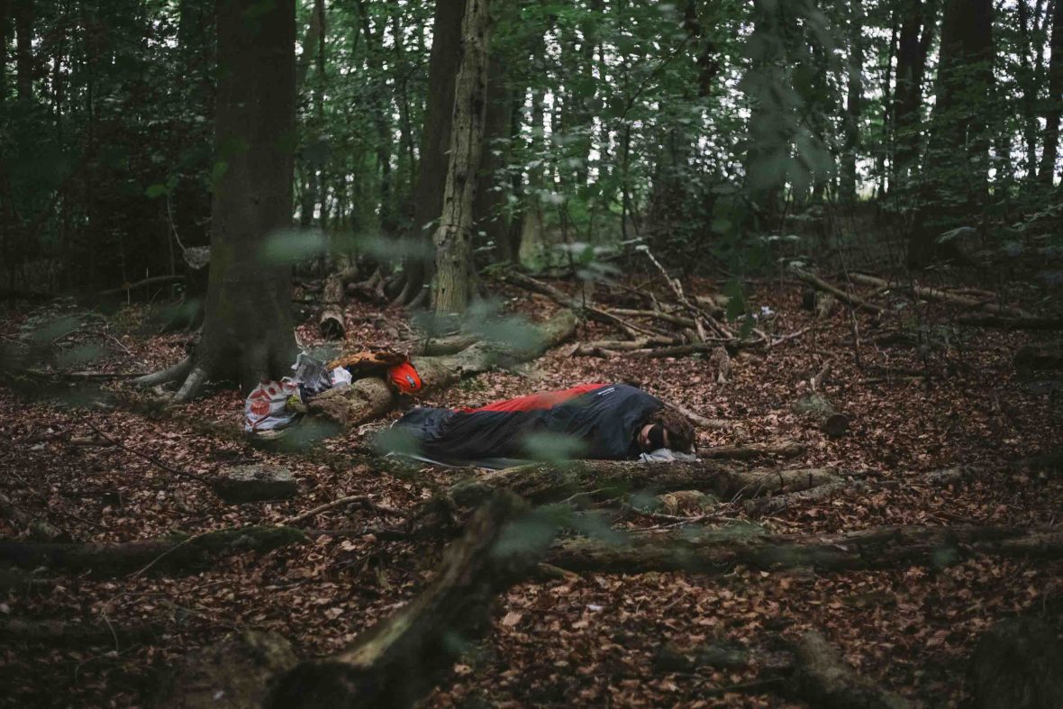 Damien camps under some trees. He has no tent and sleeps just in his sleeping bag.