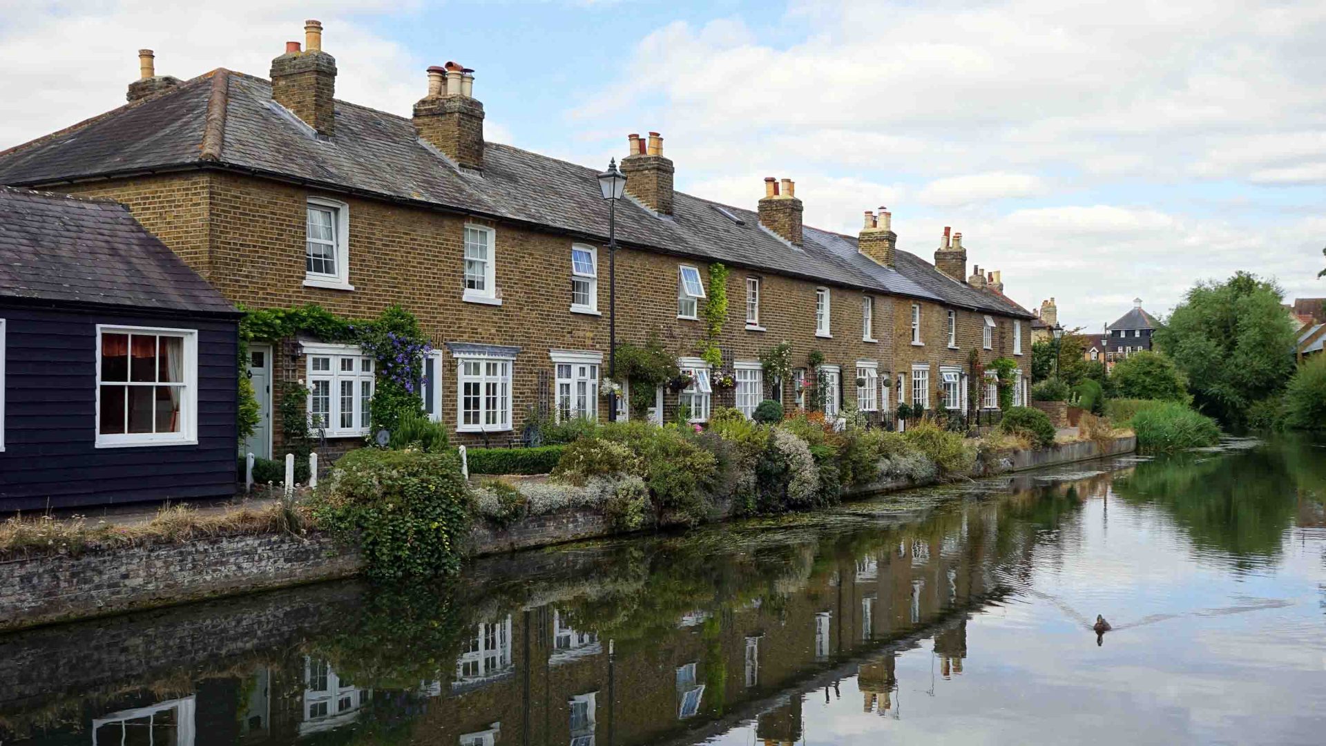 A row of houses on a canal.