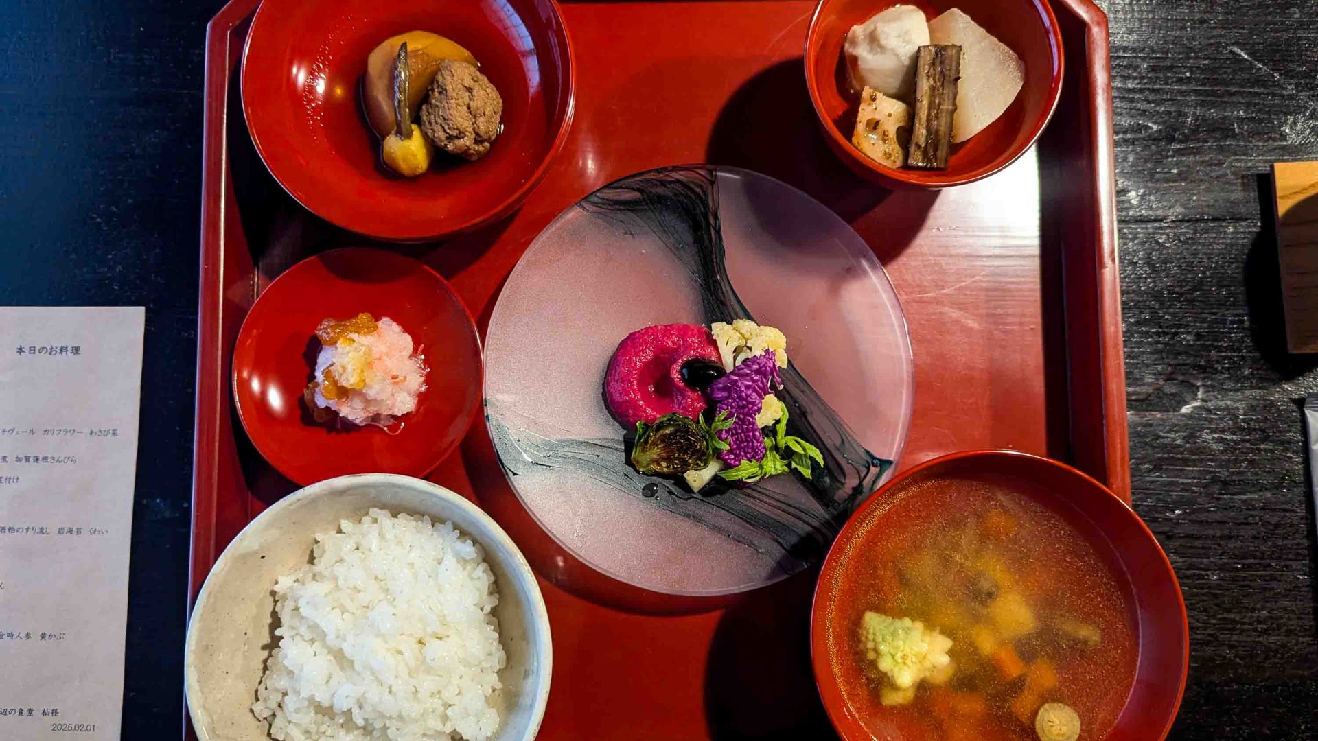 Dishes on red table.