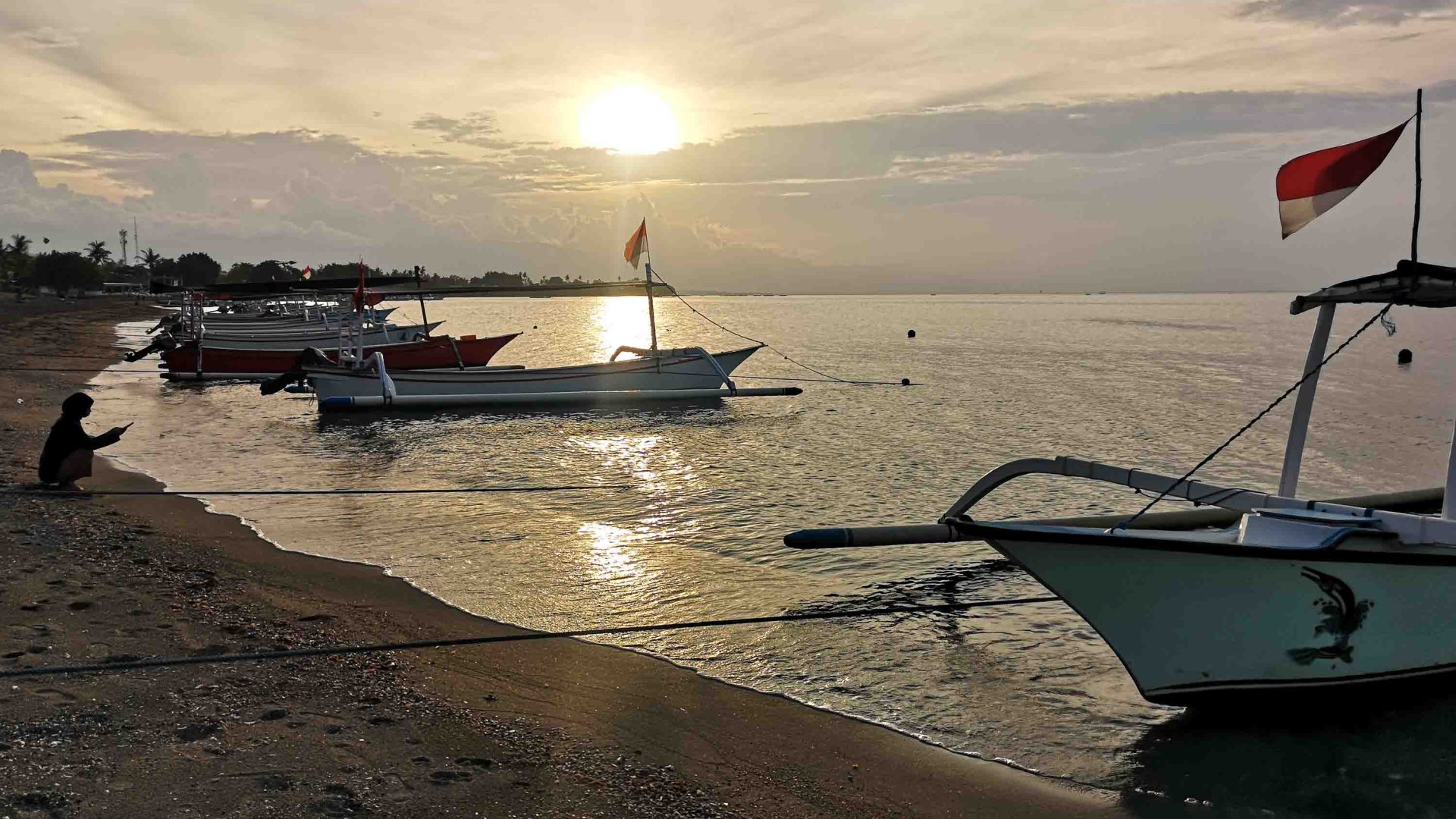 Boats in the water at sunset.