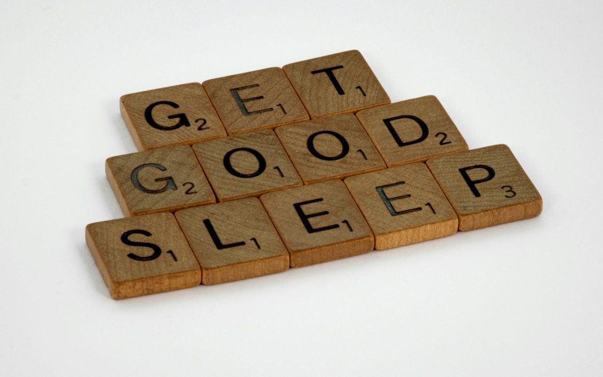 Wooden word tiles spelling out 'Get Good Sleep'