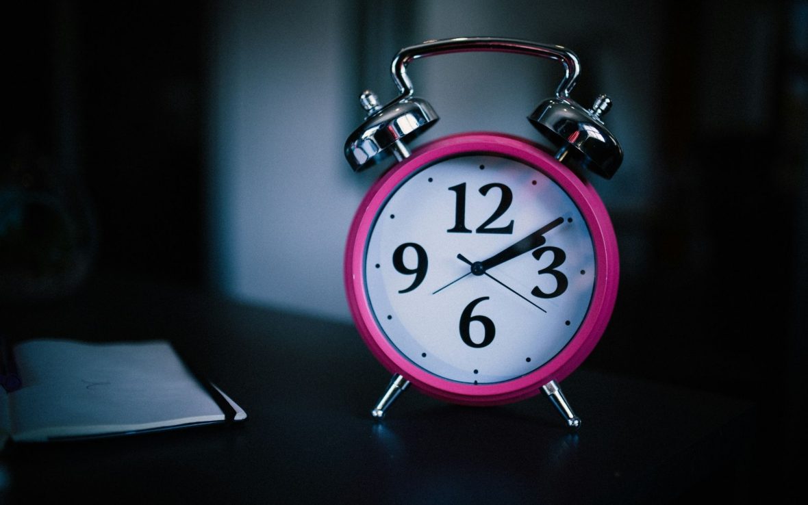 A close-up of a traditional alarm clock