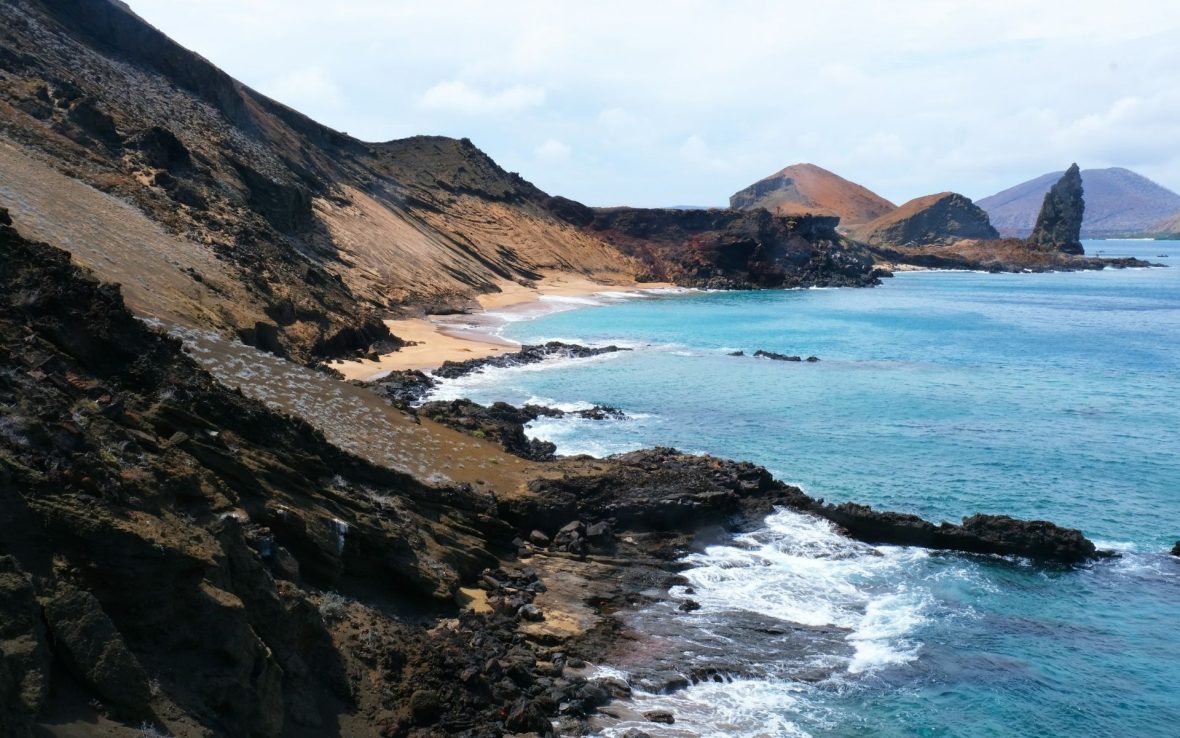 A rocky coastline and sandy bay in the Galápagos Islands