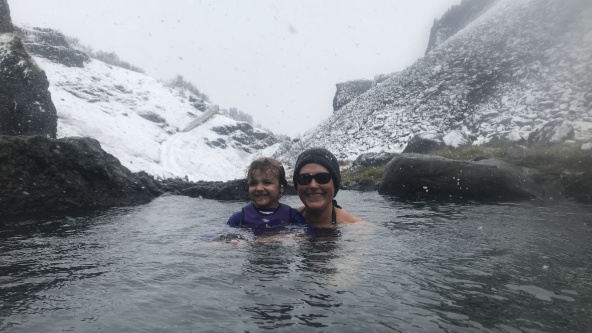 A mother and daughter swimming in Iceland's geothermal pools