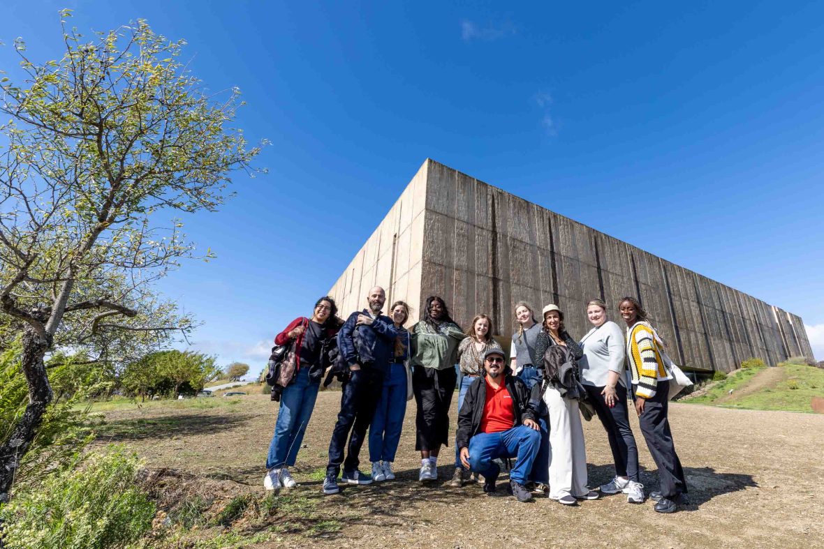 A group portrait in front of a museum.
