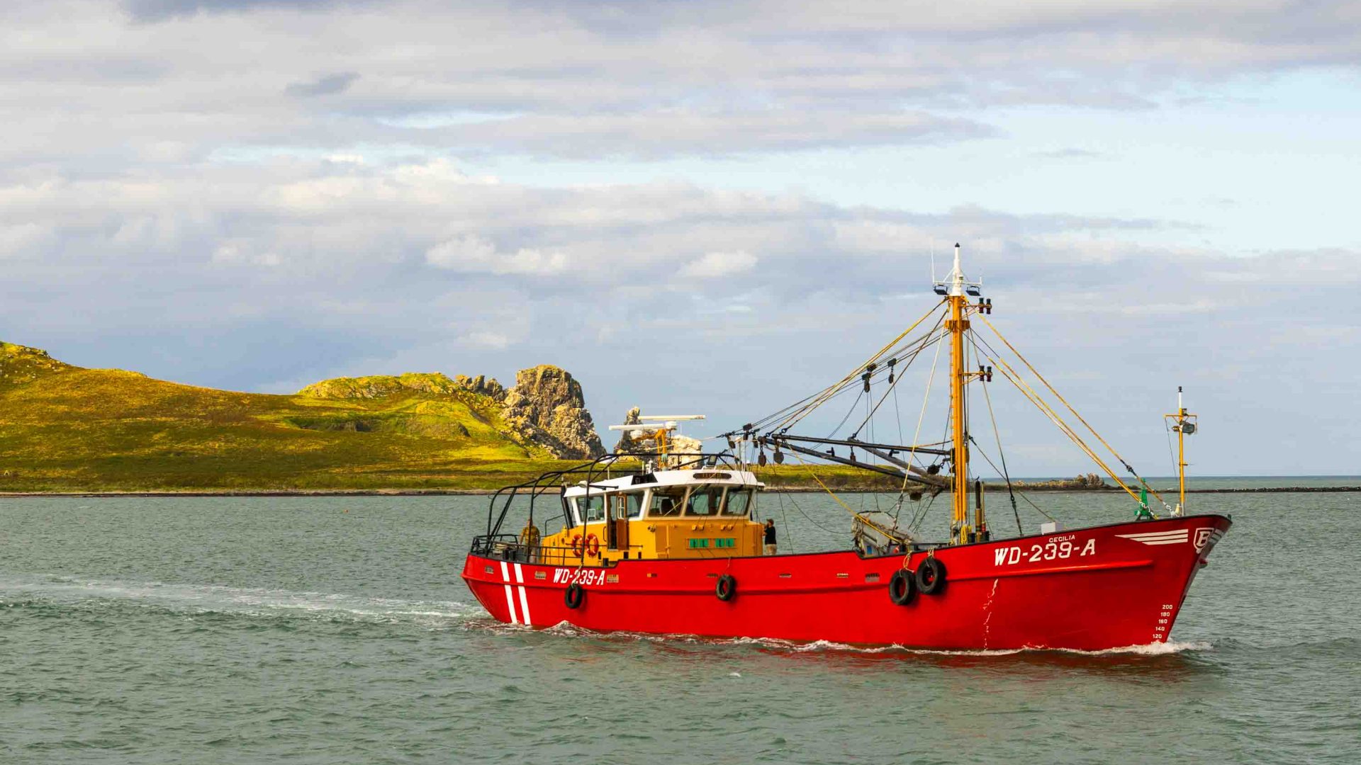 A red boat in the water.
