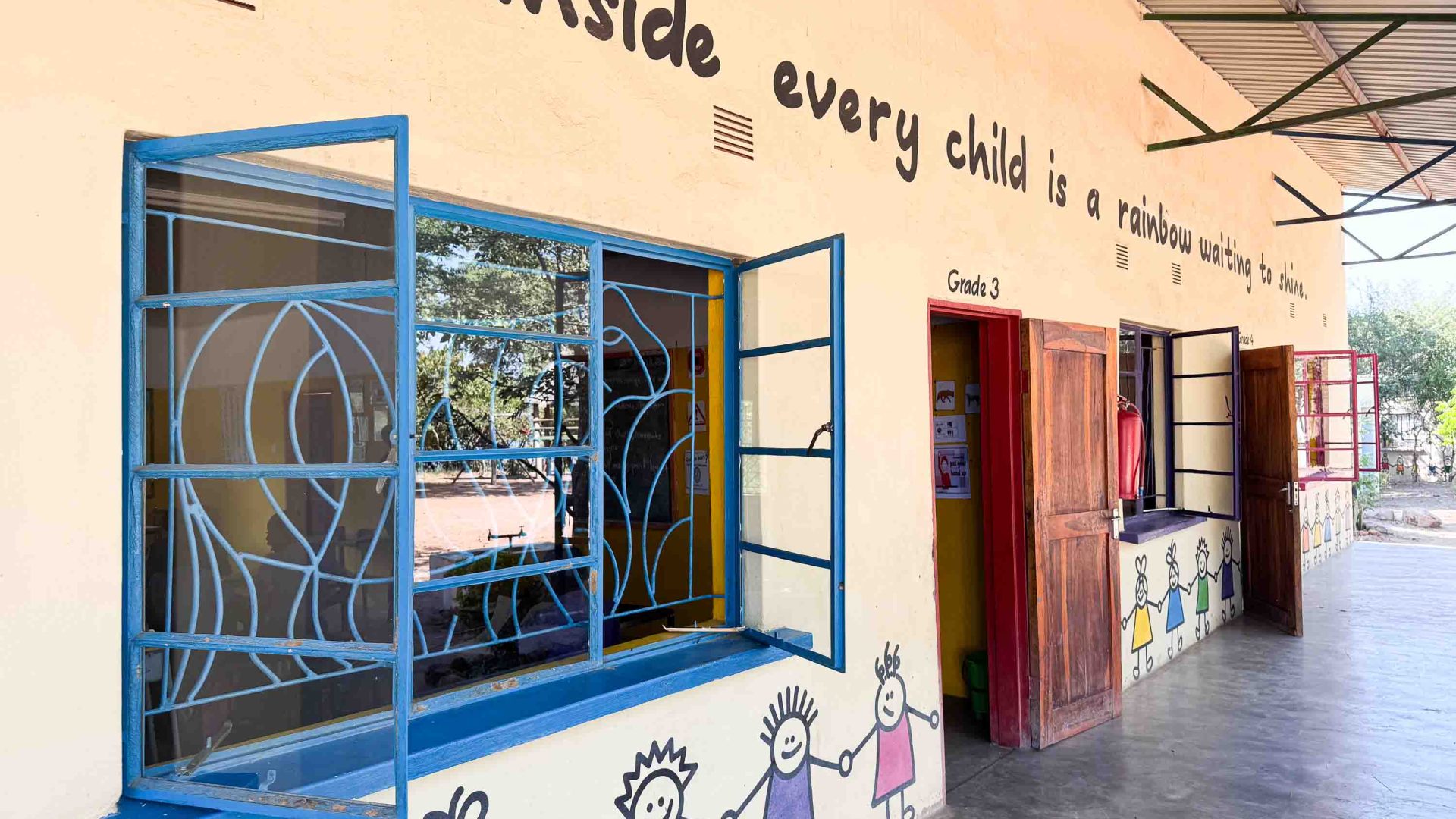 A school with paintings of children on it.