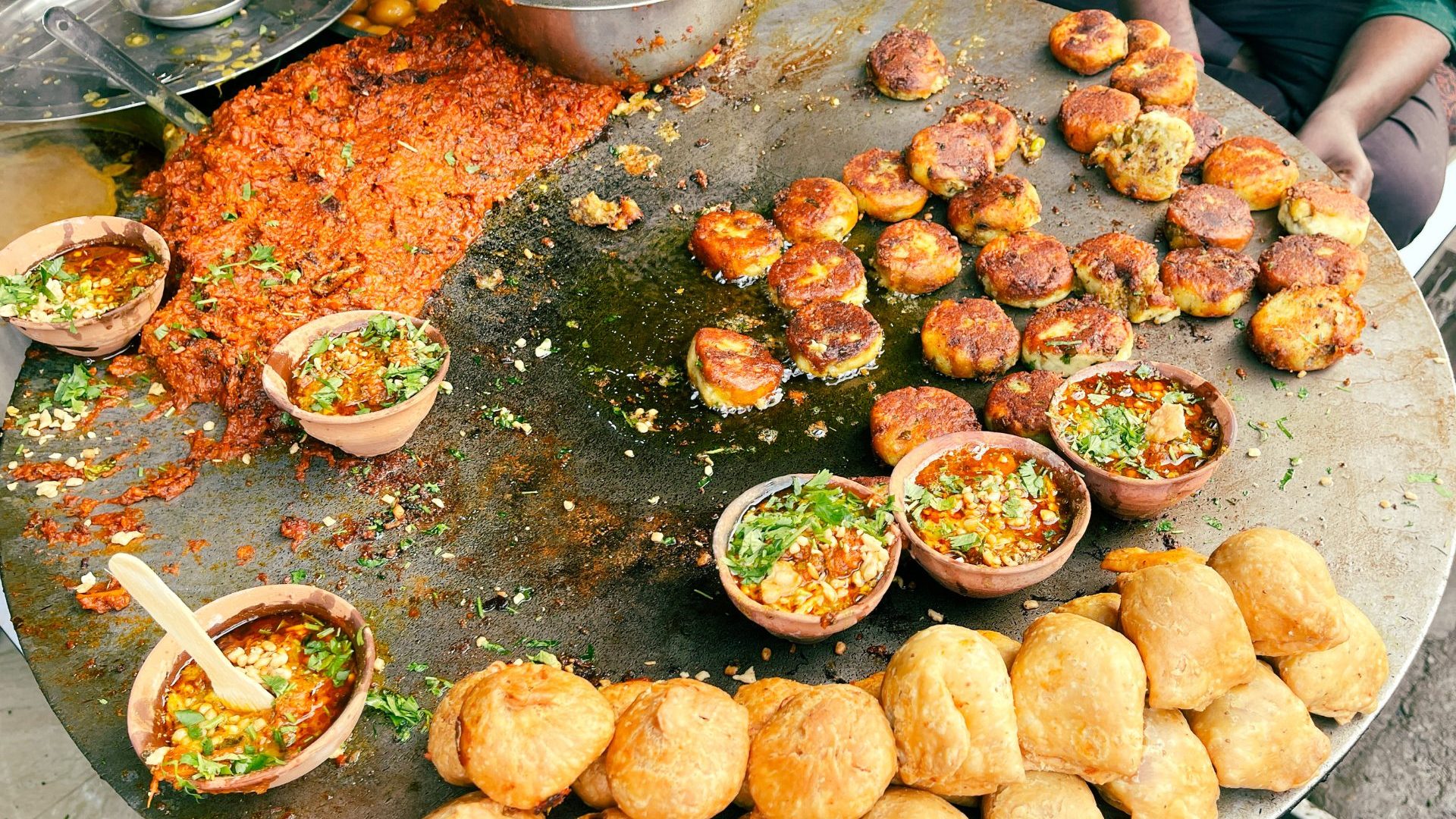 A plate of savory Indian street foods.
