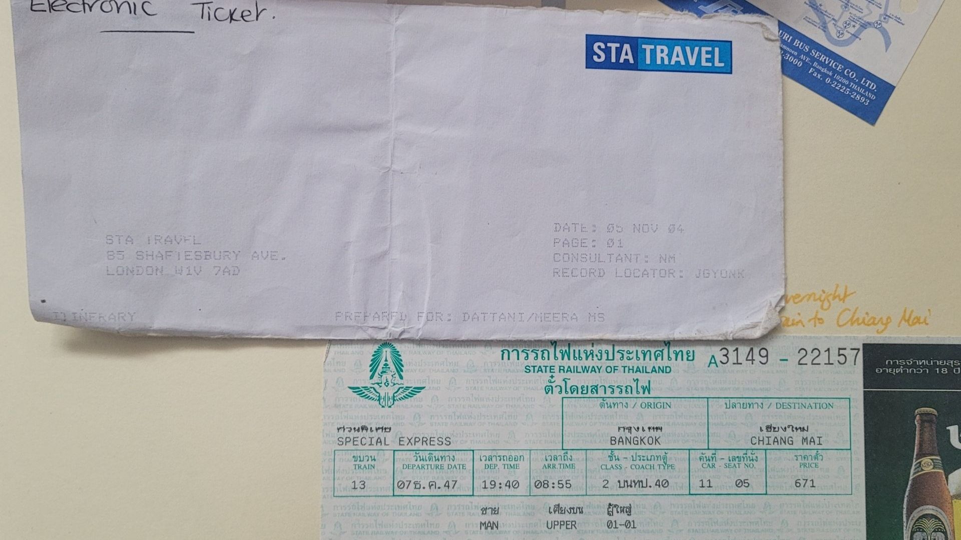 A close-up of a train ticket and a flight booking
