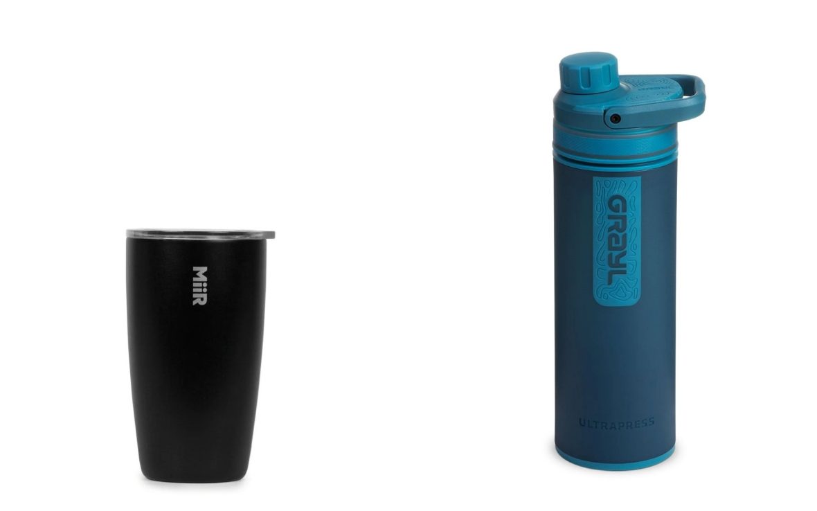 Left: A small, matte black MiiR tumbler with flat, clear plastic lid. Right: A blue Grayl water filter bottle.