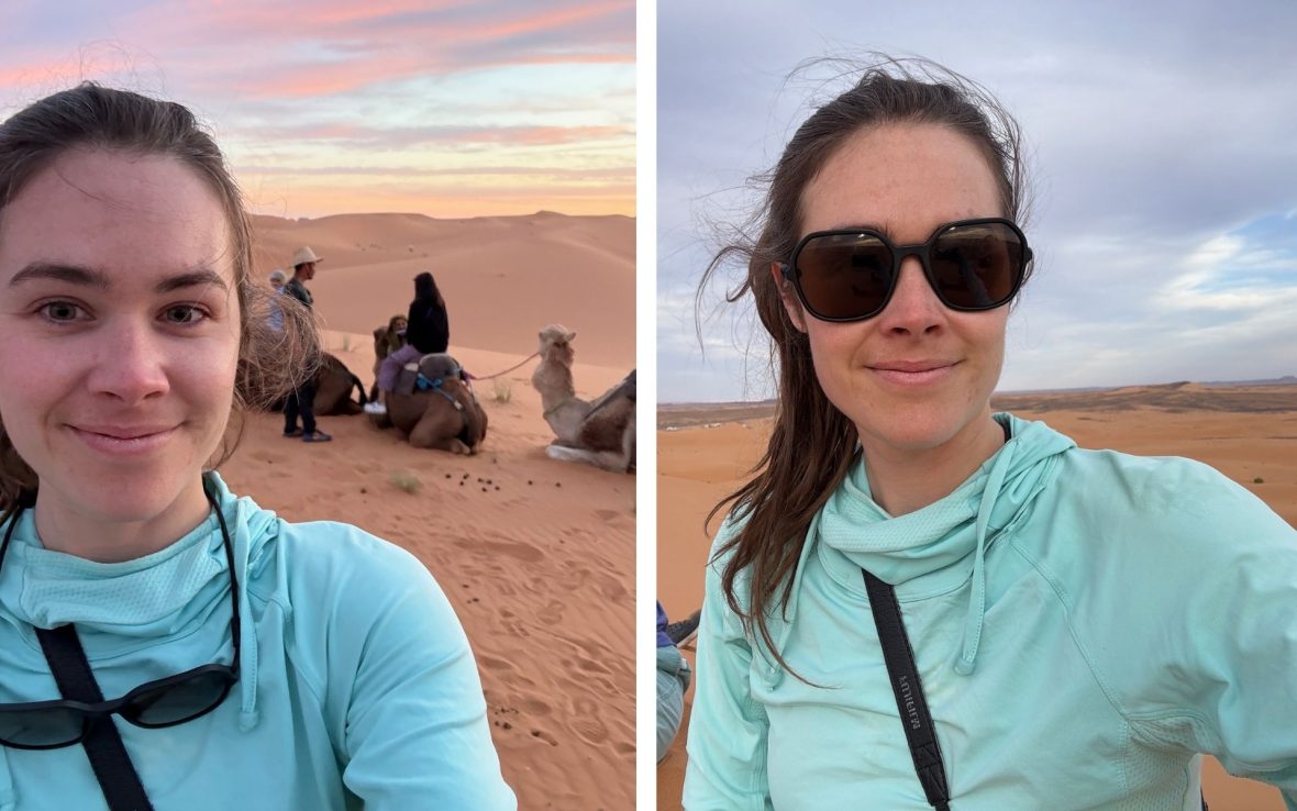 Left: A woman in a blue shirt takes a selfie with sunglasses hanging from her neck; right, the same woman has the sunglasses on her face. In both photos, sand dunes are in the background. On the left, there are camels.