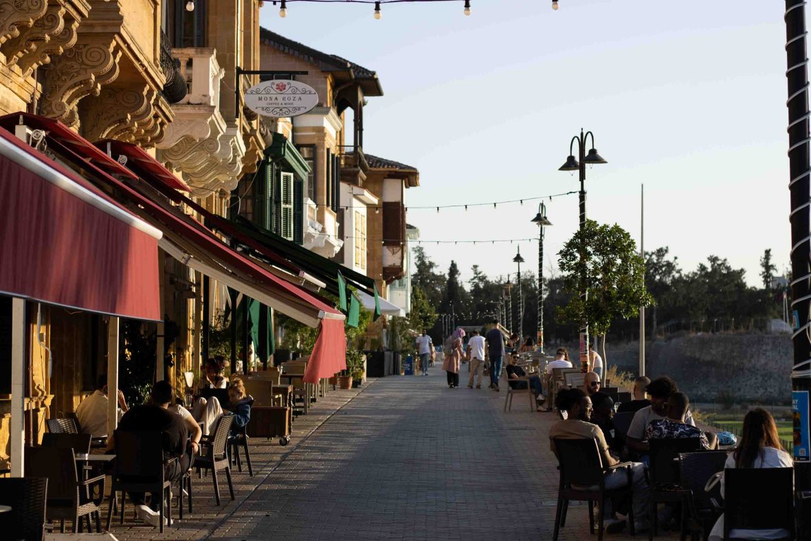 A street lined with cafes and bars.