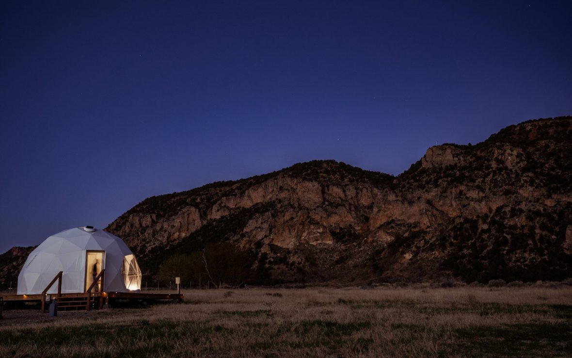 Glowing dome beneath a starry sky