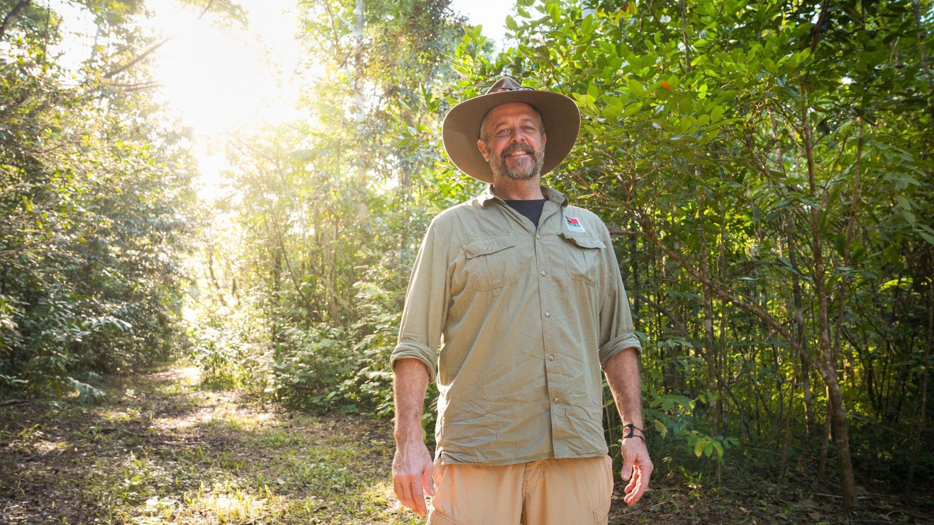 Man stands in the rainforest