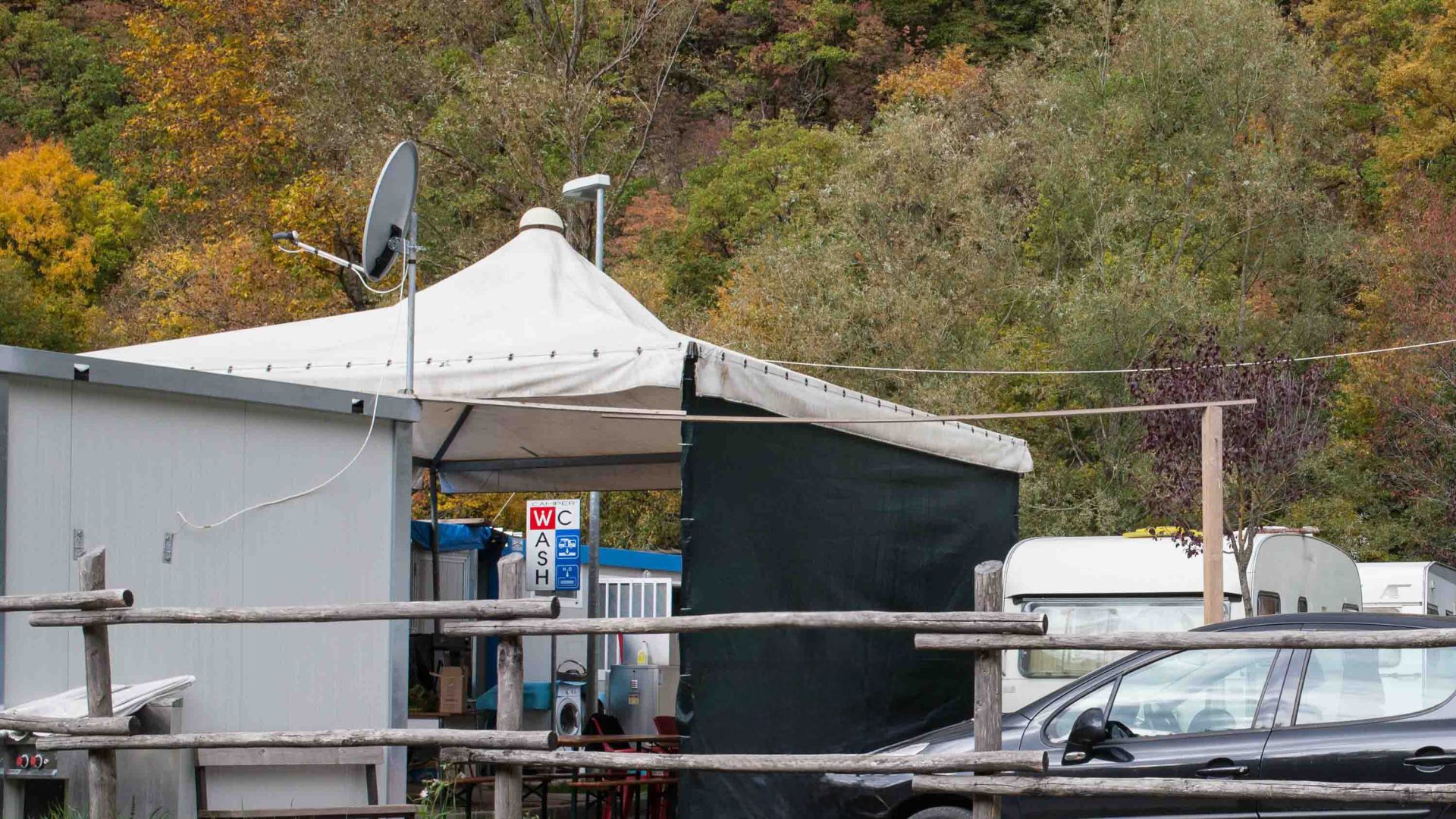 A tent alongside some caravans.