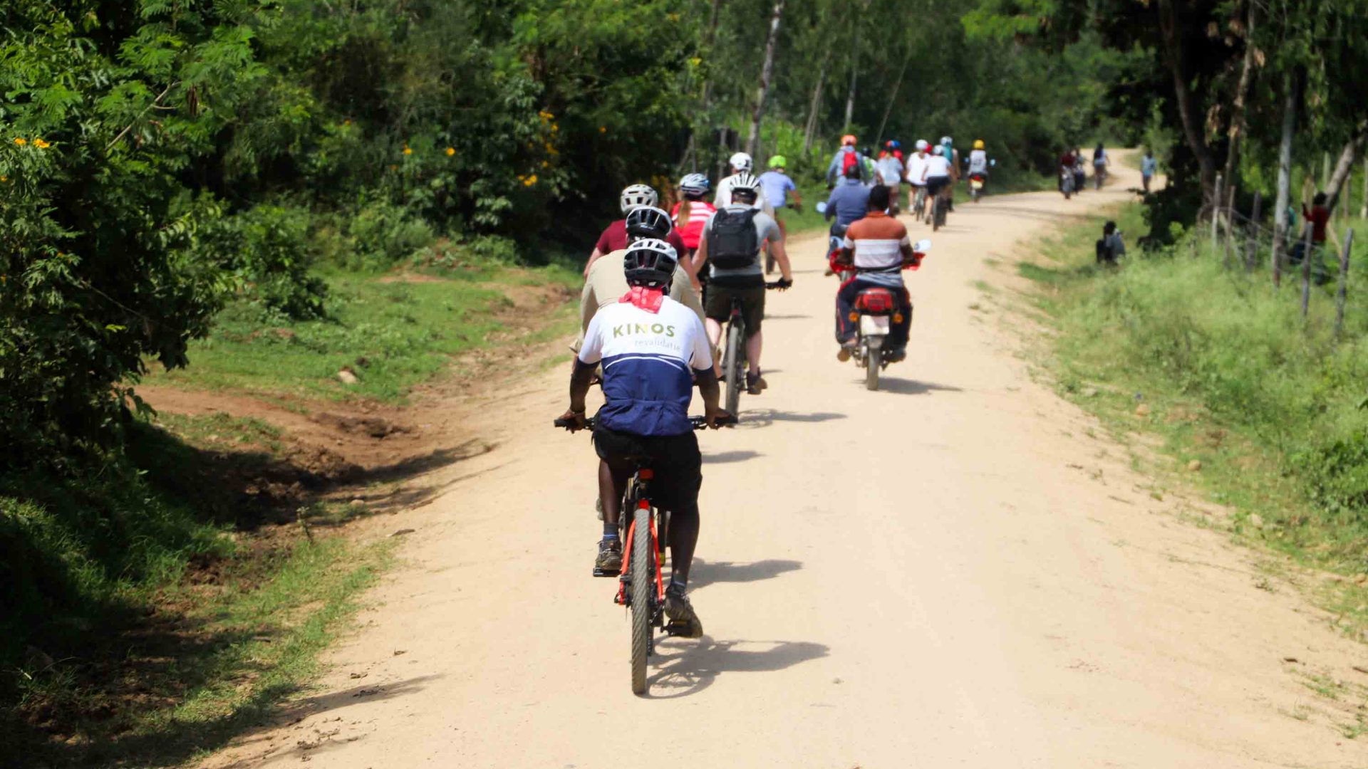 Riders on a dusty road.