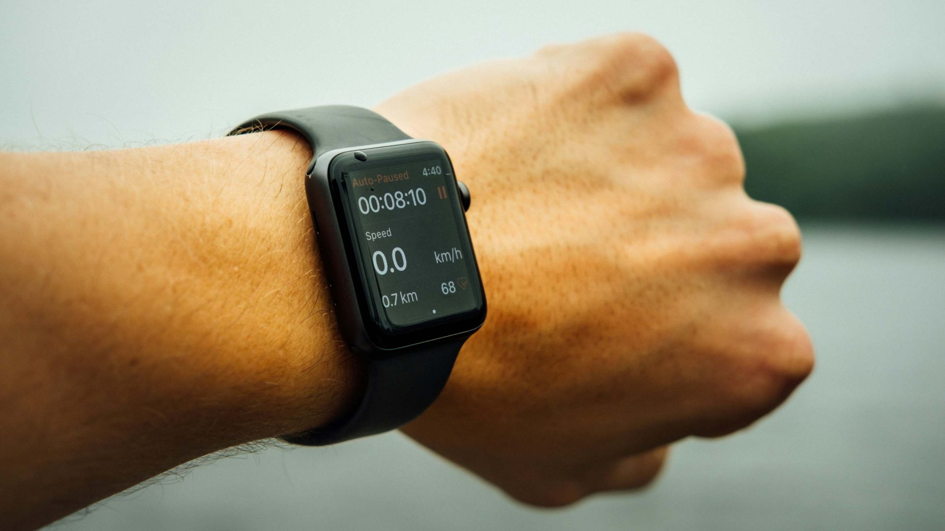 A person's wrist with a watch on it with the Strava app.
