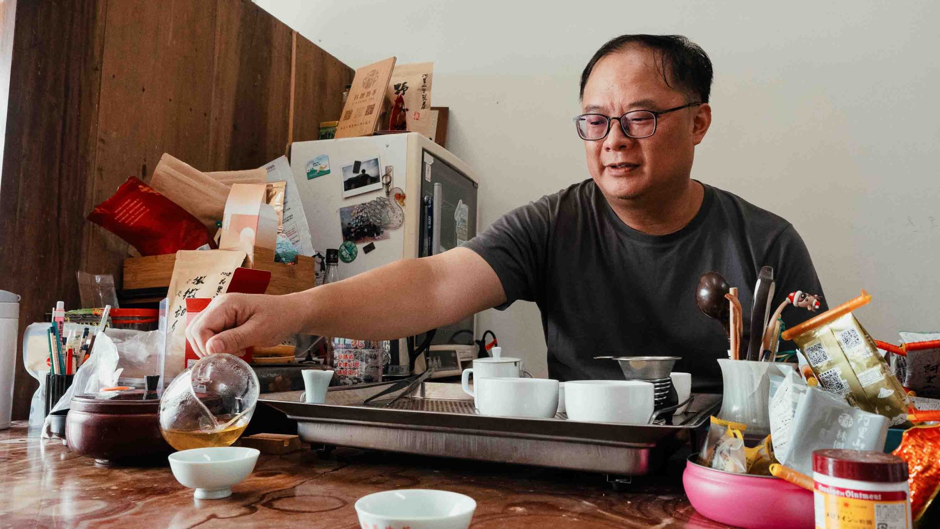 A man serves tea.