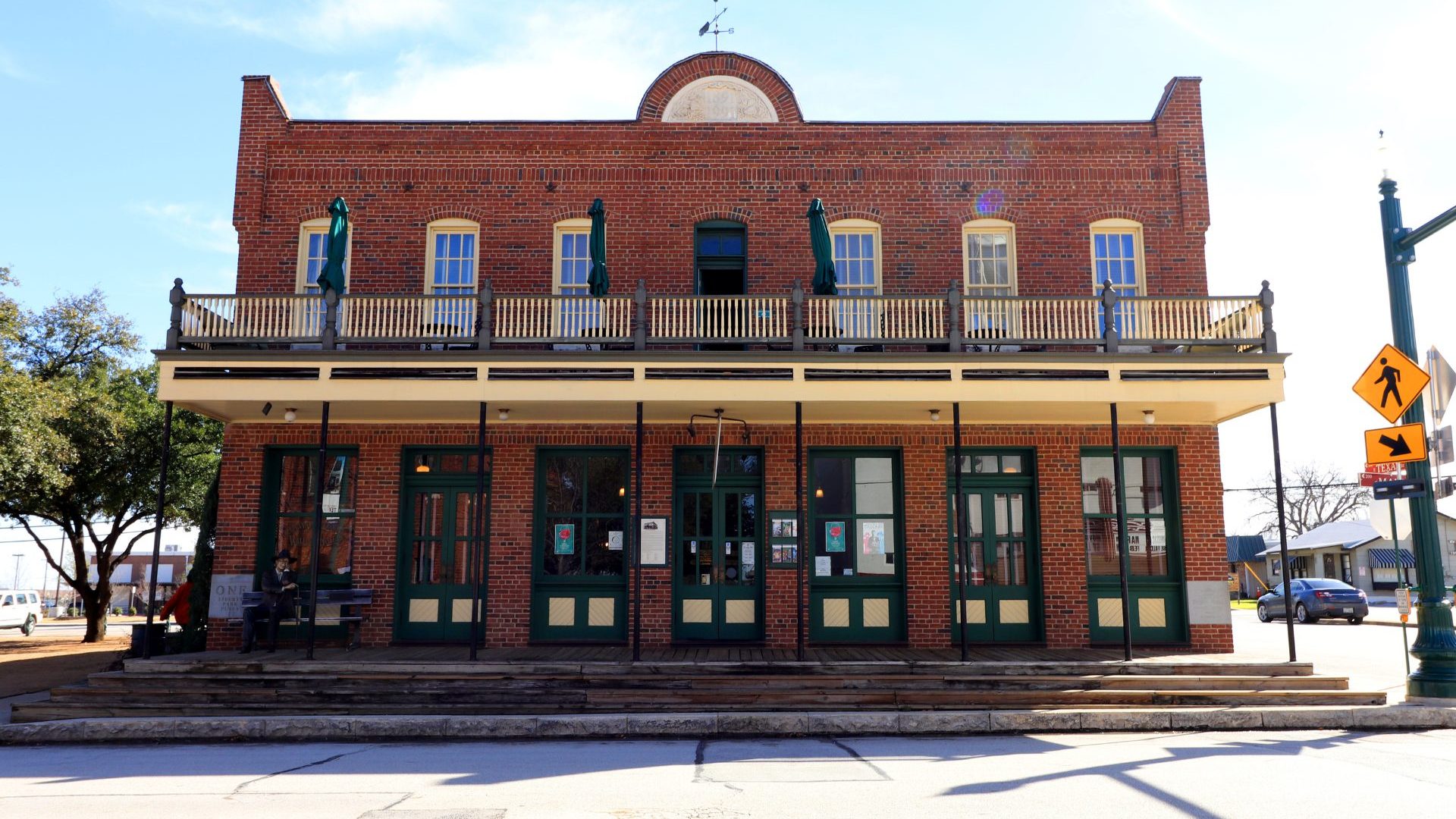 A brown brick building under blue sky