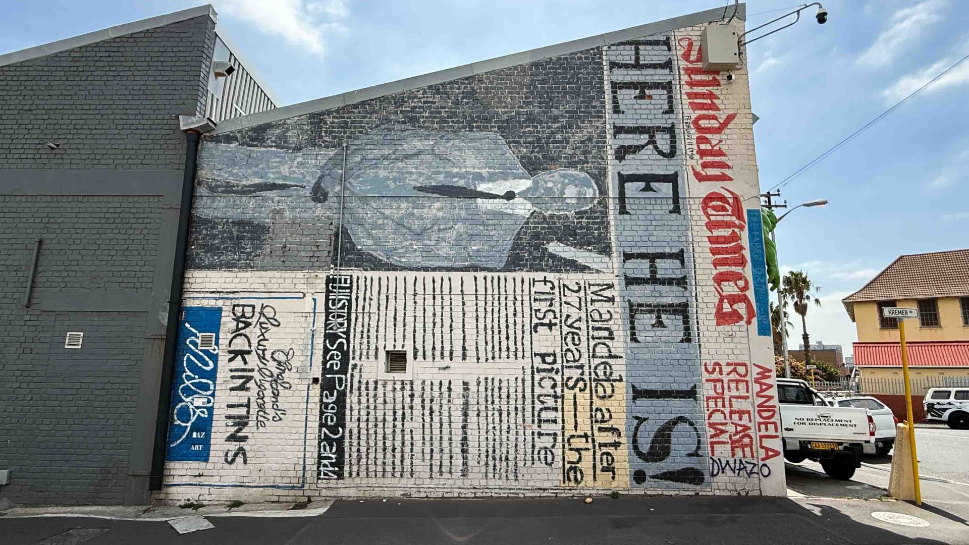 A mural that looks like a black and white news article on its side.