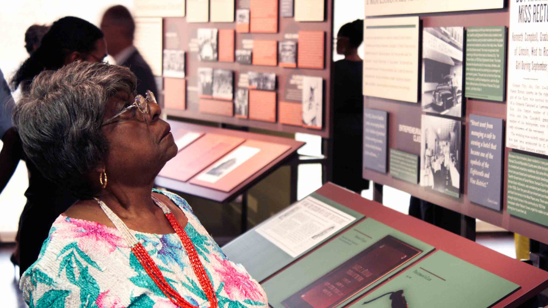 A woman looks at an information display at the Black Archives.