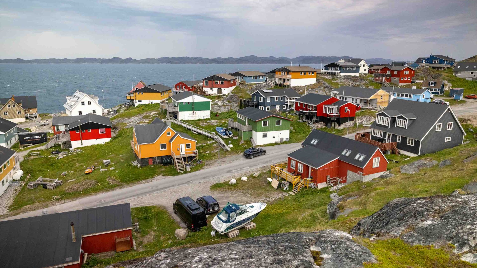Looking down over a town of colourful houses.