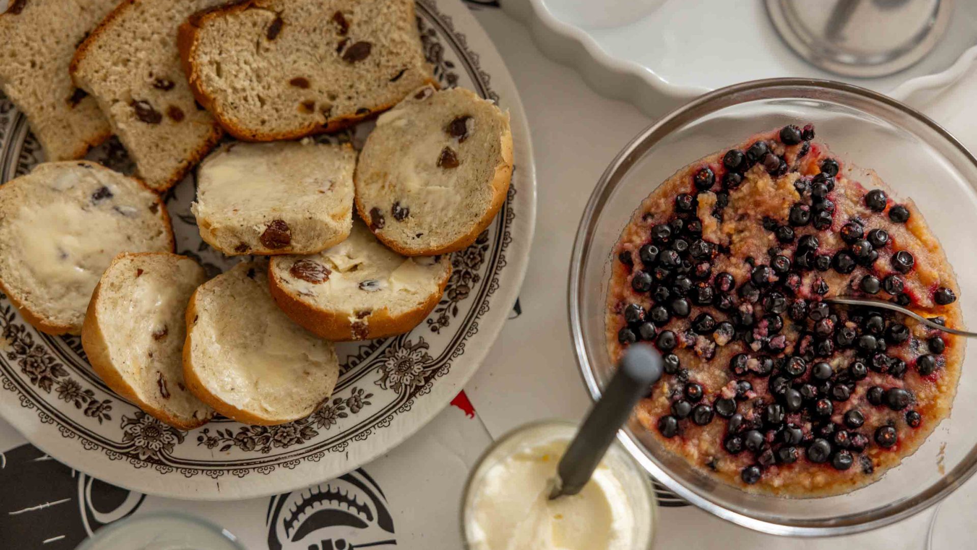 Plates of food, including bread and butter.