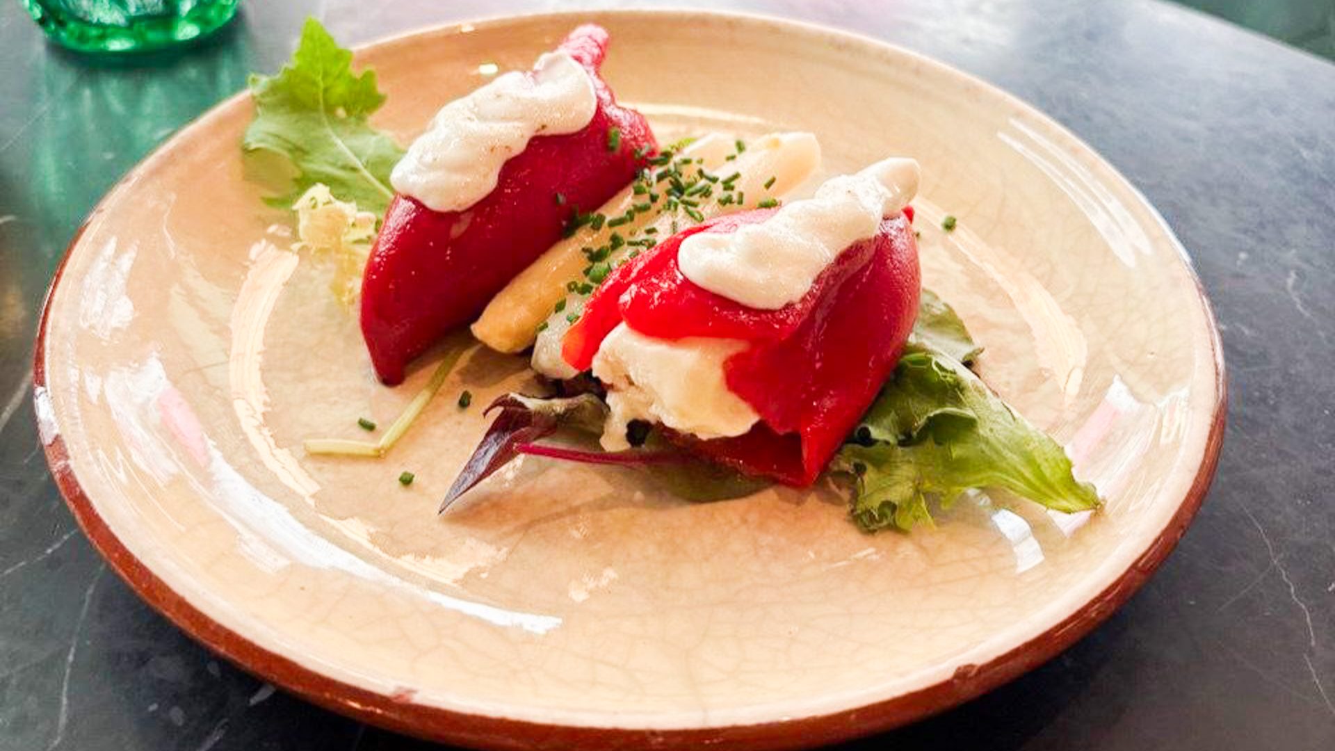 Peppers stuffed with a vegan cheese.