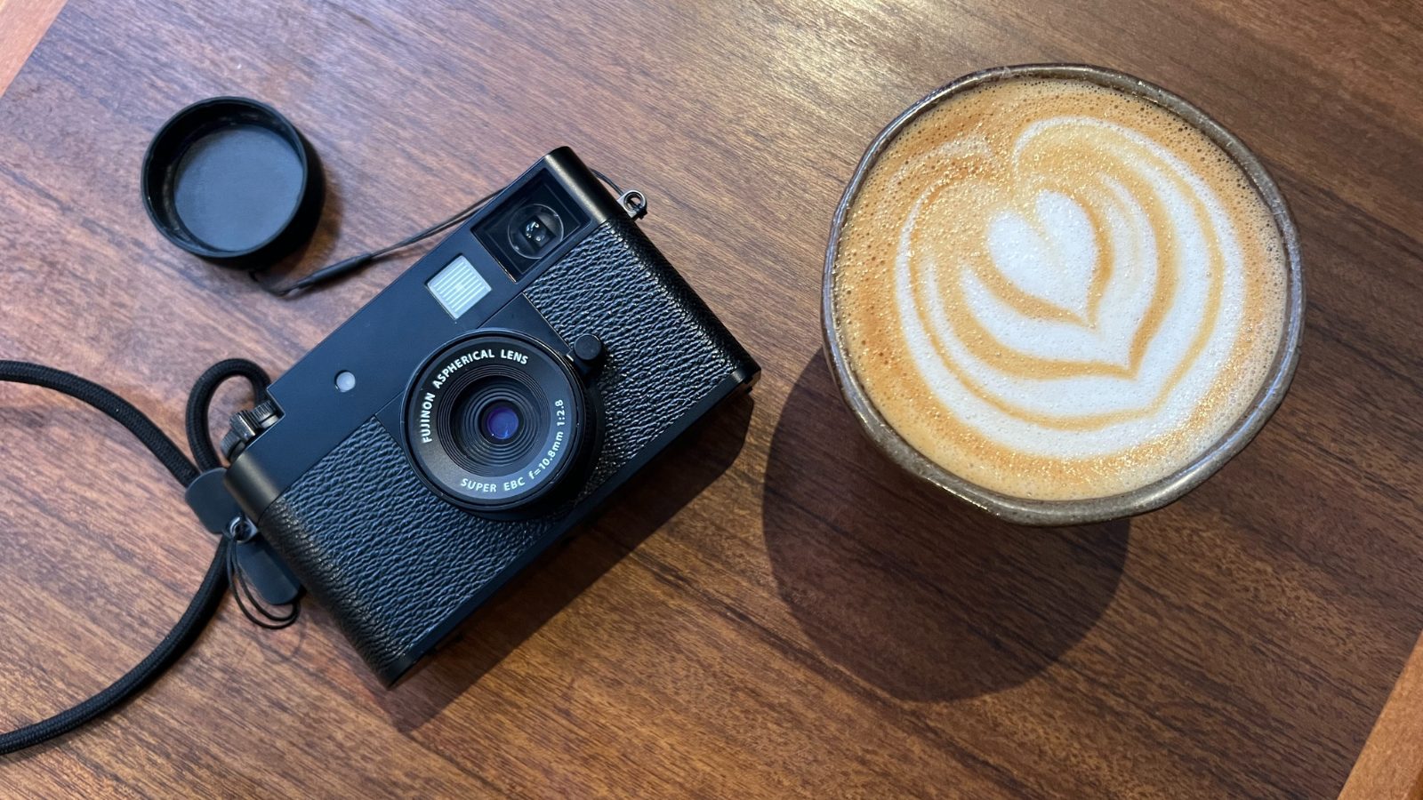 Is this pocket-sized Fuji the perfect travel camera, or an overpriced gimmick? 