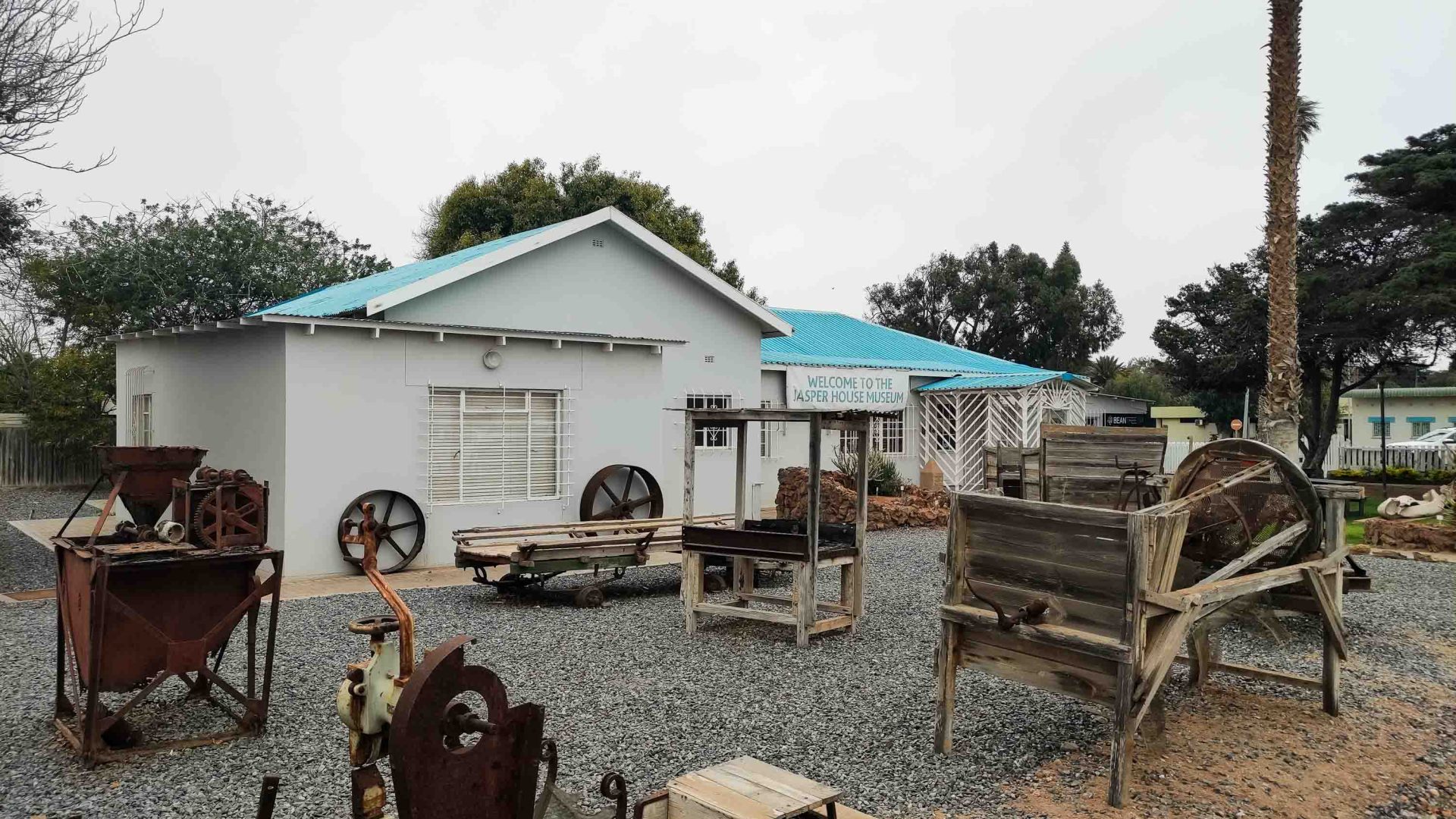 A museum with rusting relics out front.