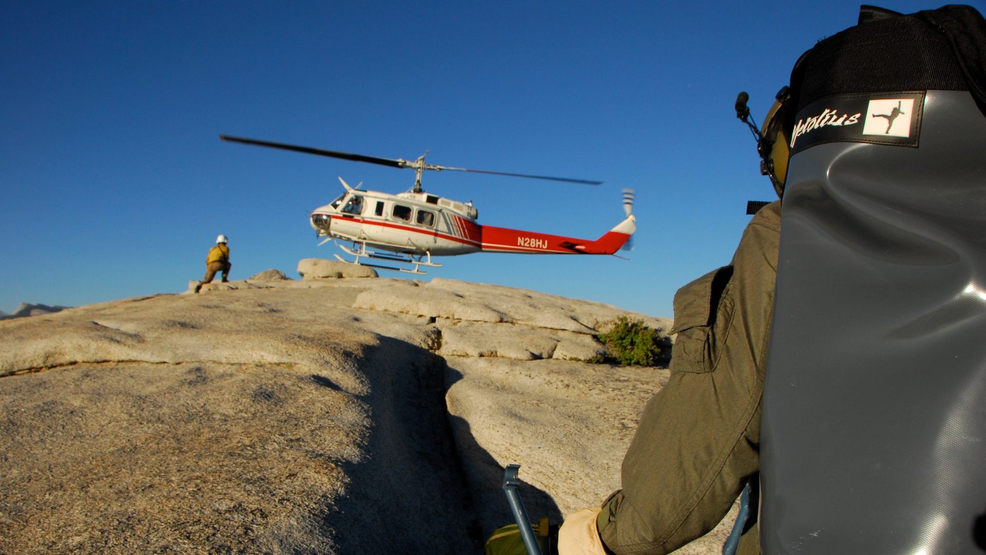 Emergency helicopter lands on mountain top