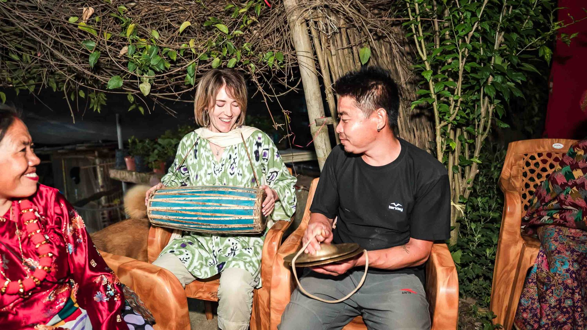 Two people play musical instruments together.