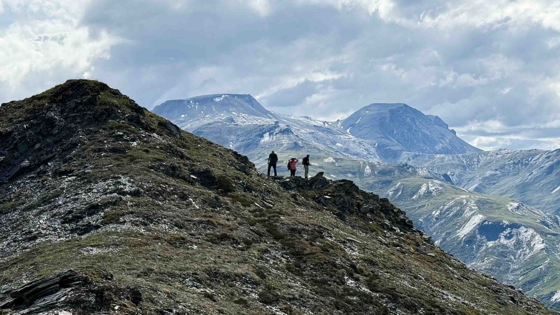 People hike a mountain.