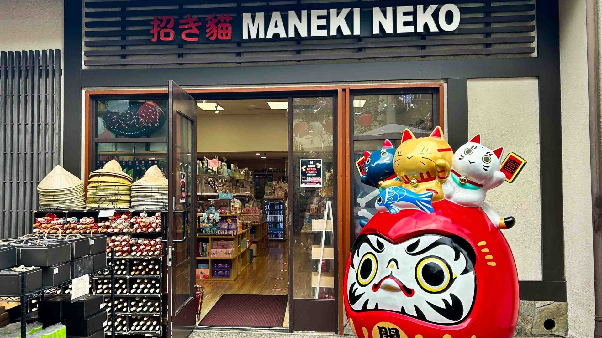 the exterior of a store with a model anime figure.