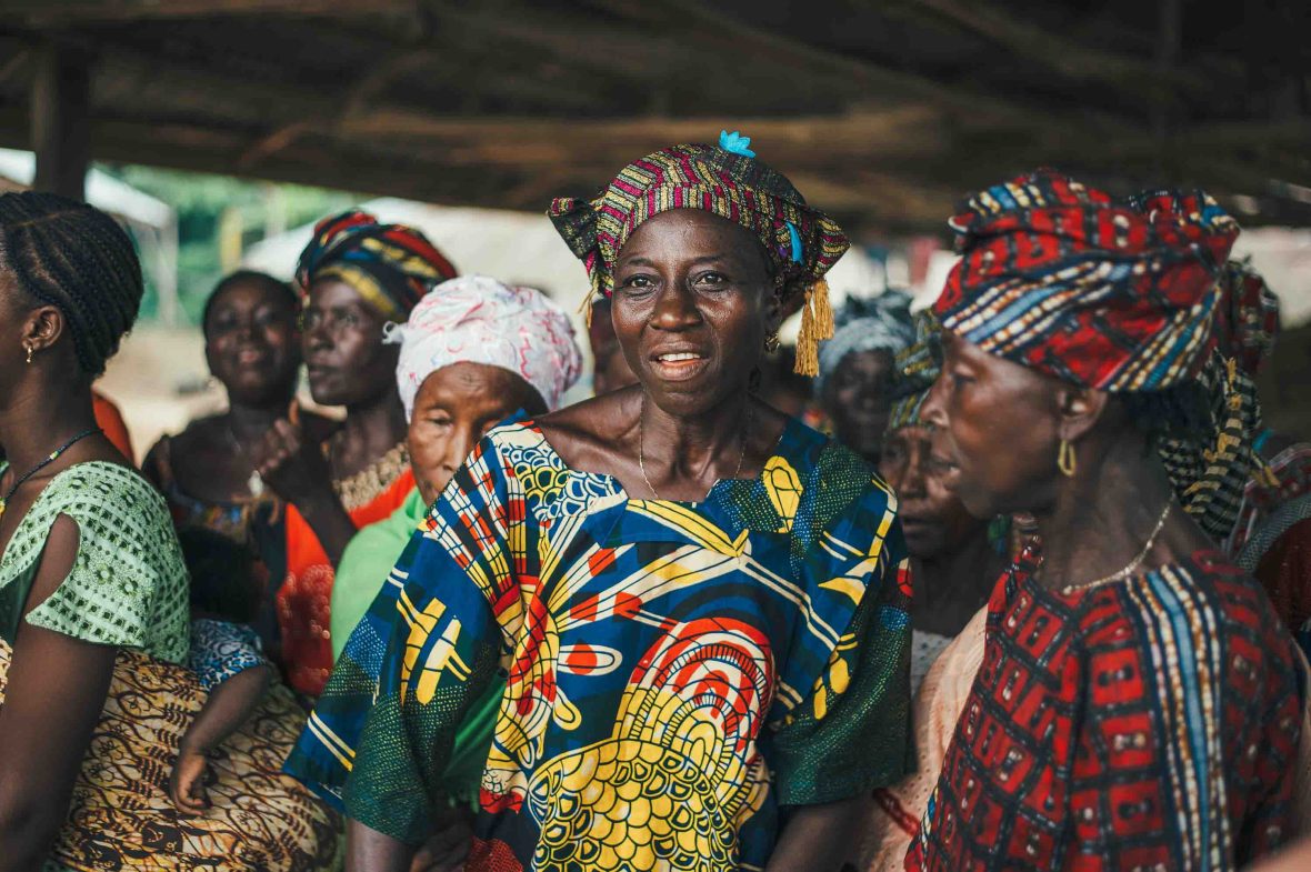 A number of women of African descent wearing colourful clothing.