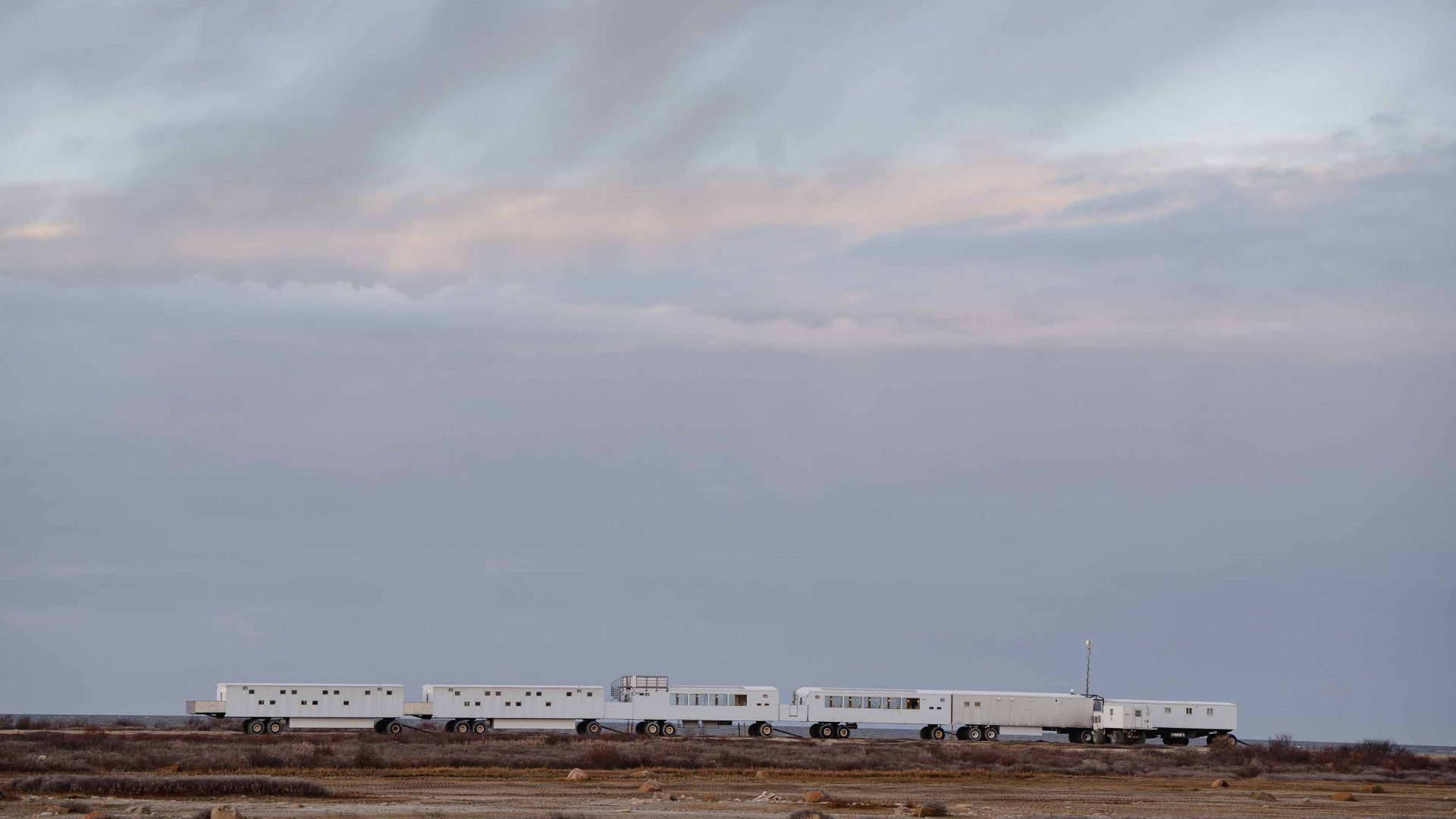 Long caravan style accomodation, linked together on the tundra.