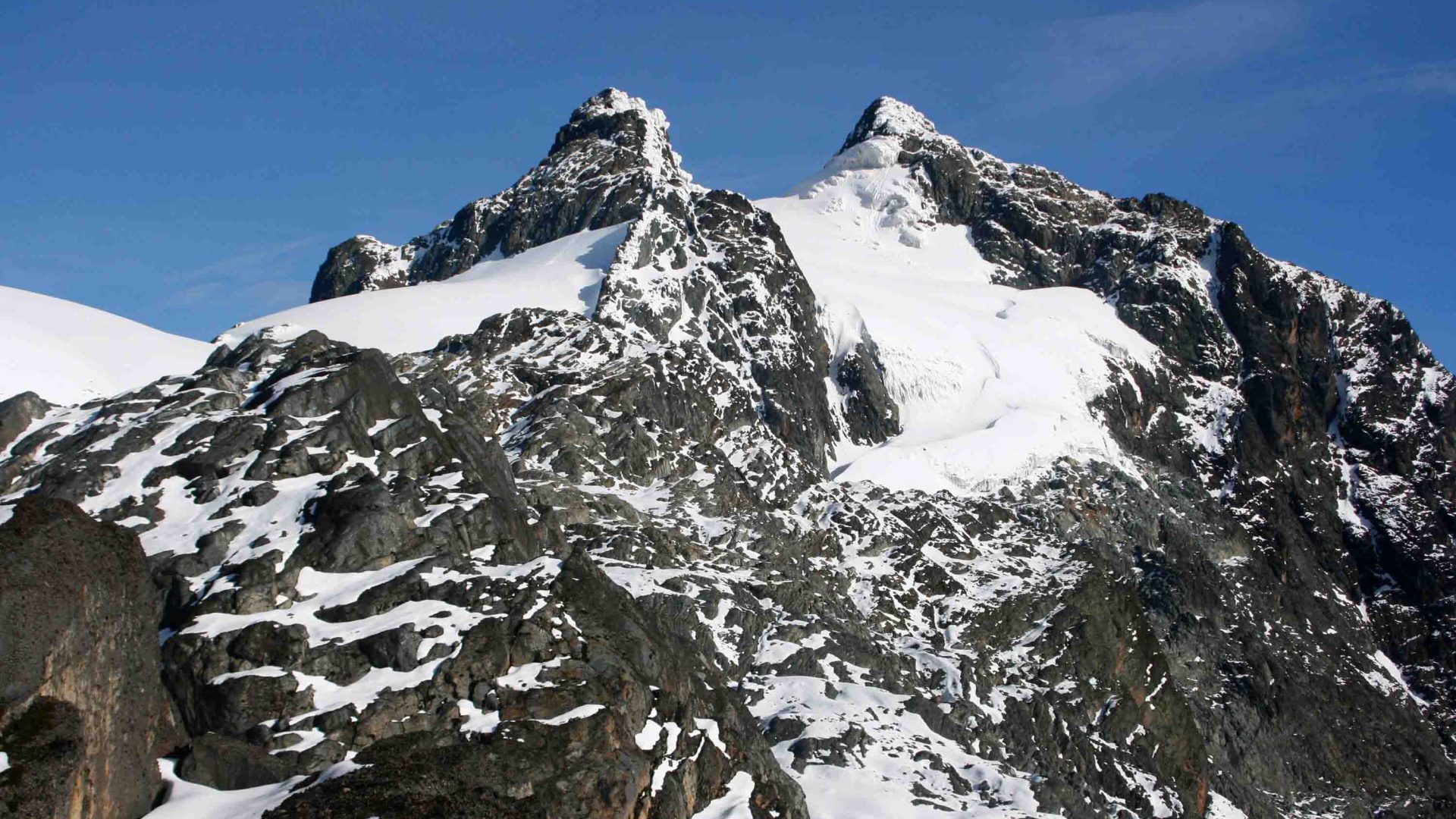A snowy covered mountain peak.