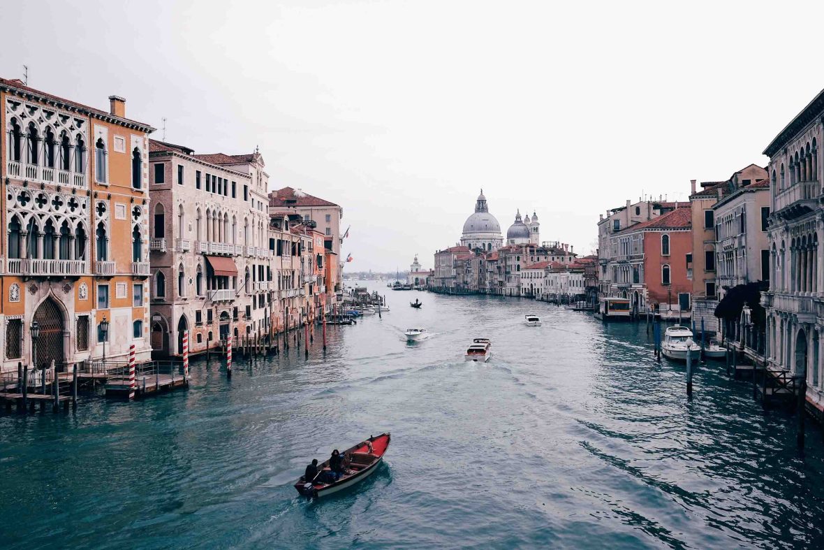 Boats move through the waterways of Venice.