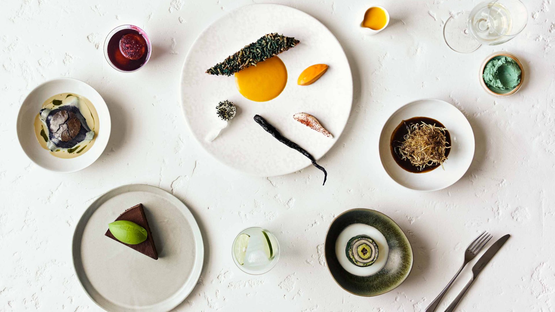 A table covered in beautifully presented desserts.