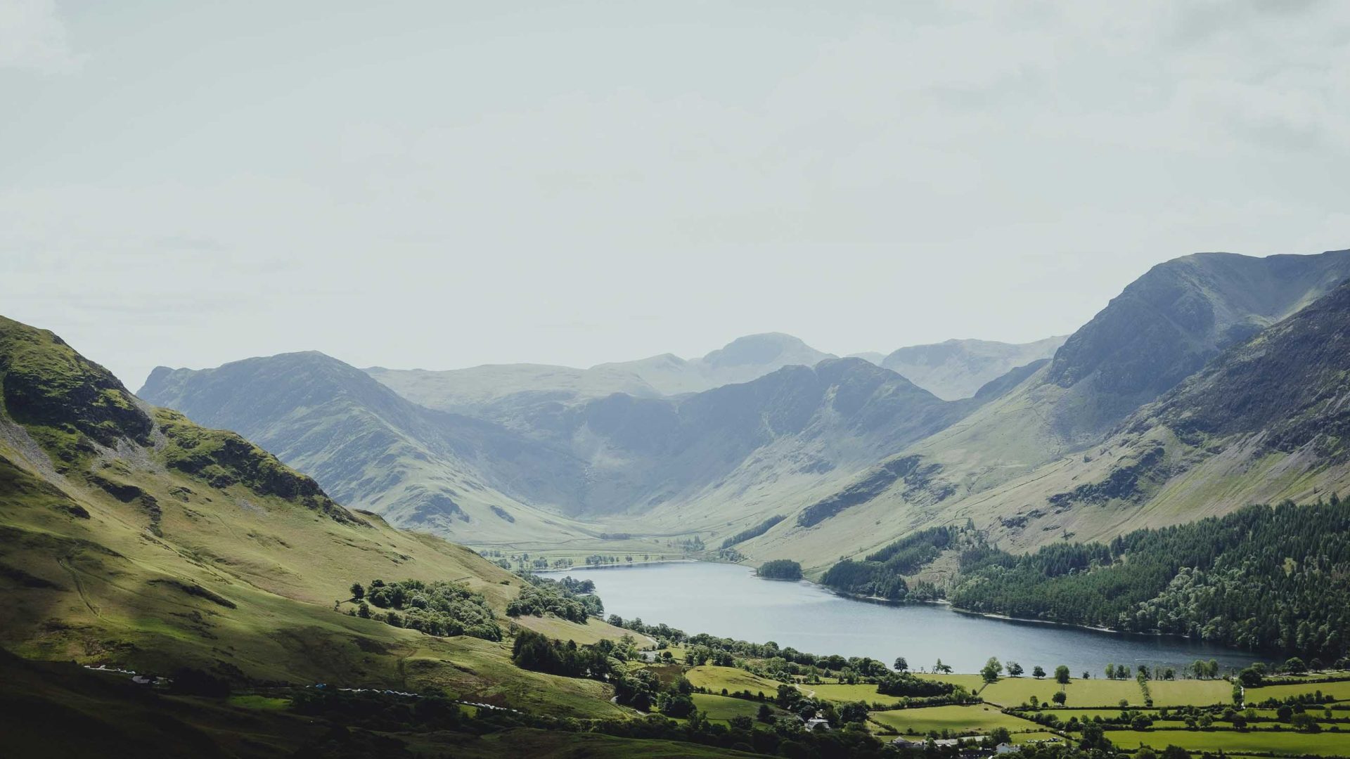 Hills roll down to a lake at the base.