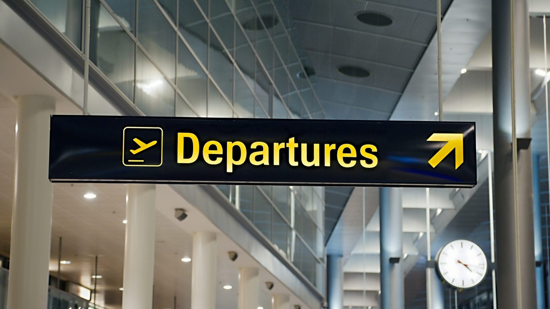 A black sign reads 'Departures' in yellow.