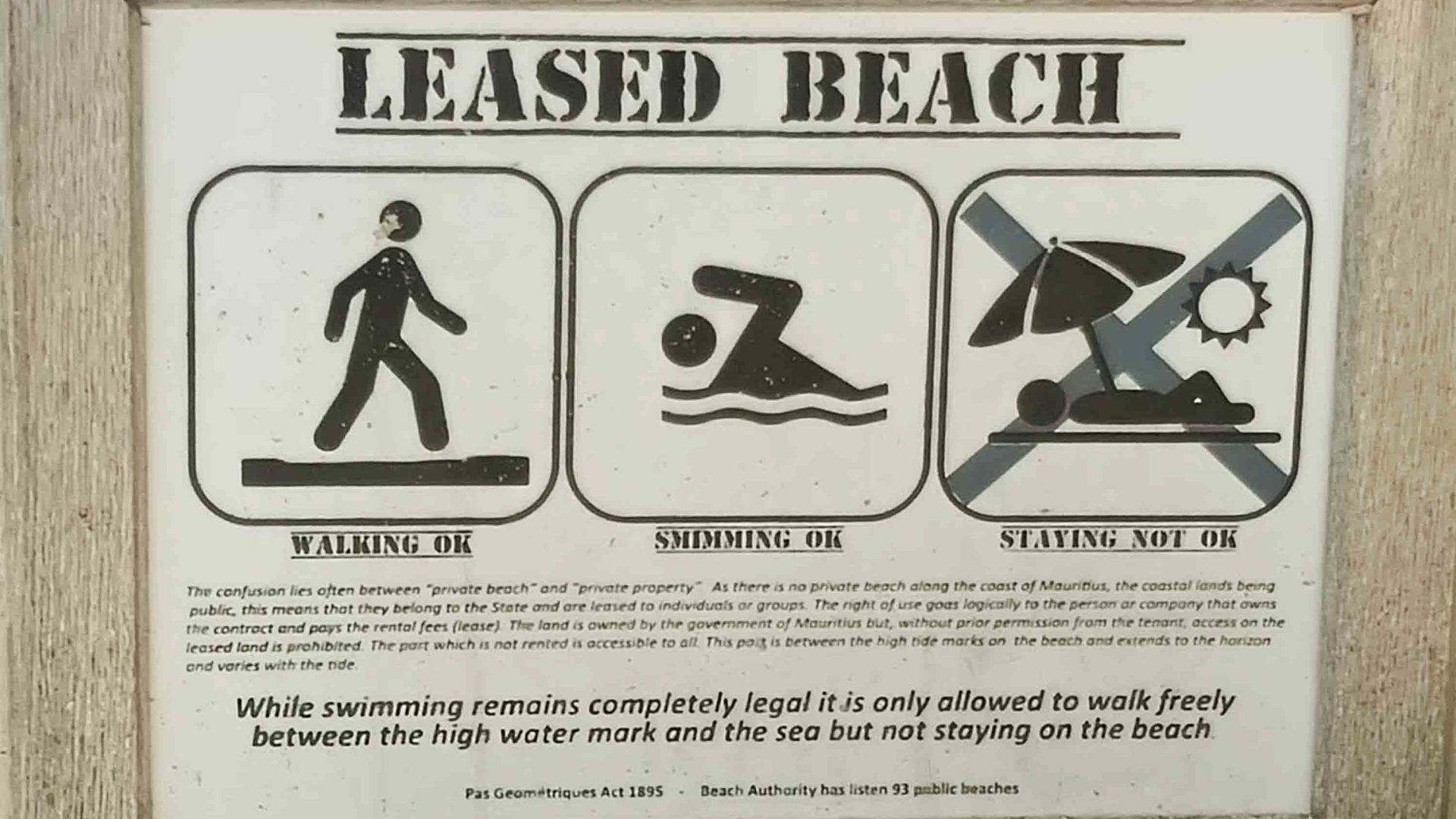 A sign that says swimming and walking is okay but staying for an extended period is not.